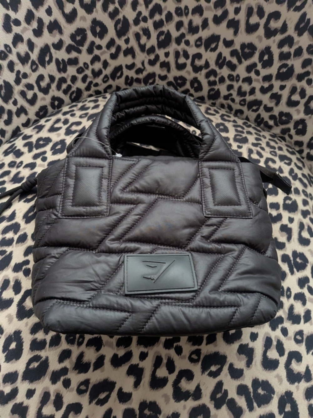 Gymshark Quilted Mini Tote in black featuring a distinctive geometric quilted